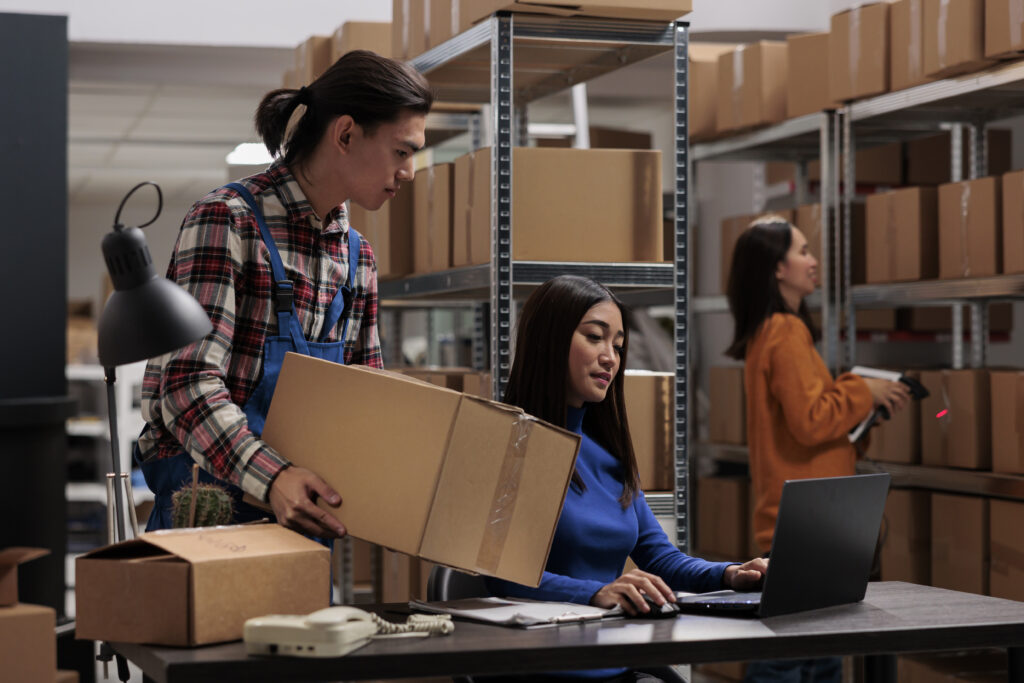 Customer support outsourcing logistics employees inside warehouse